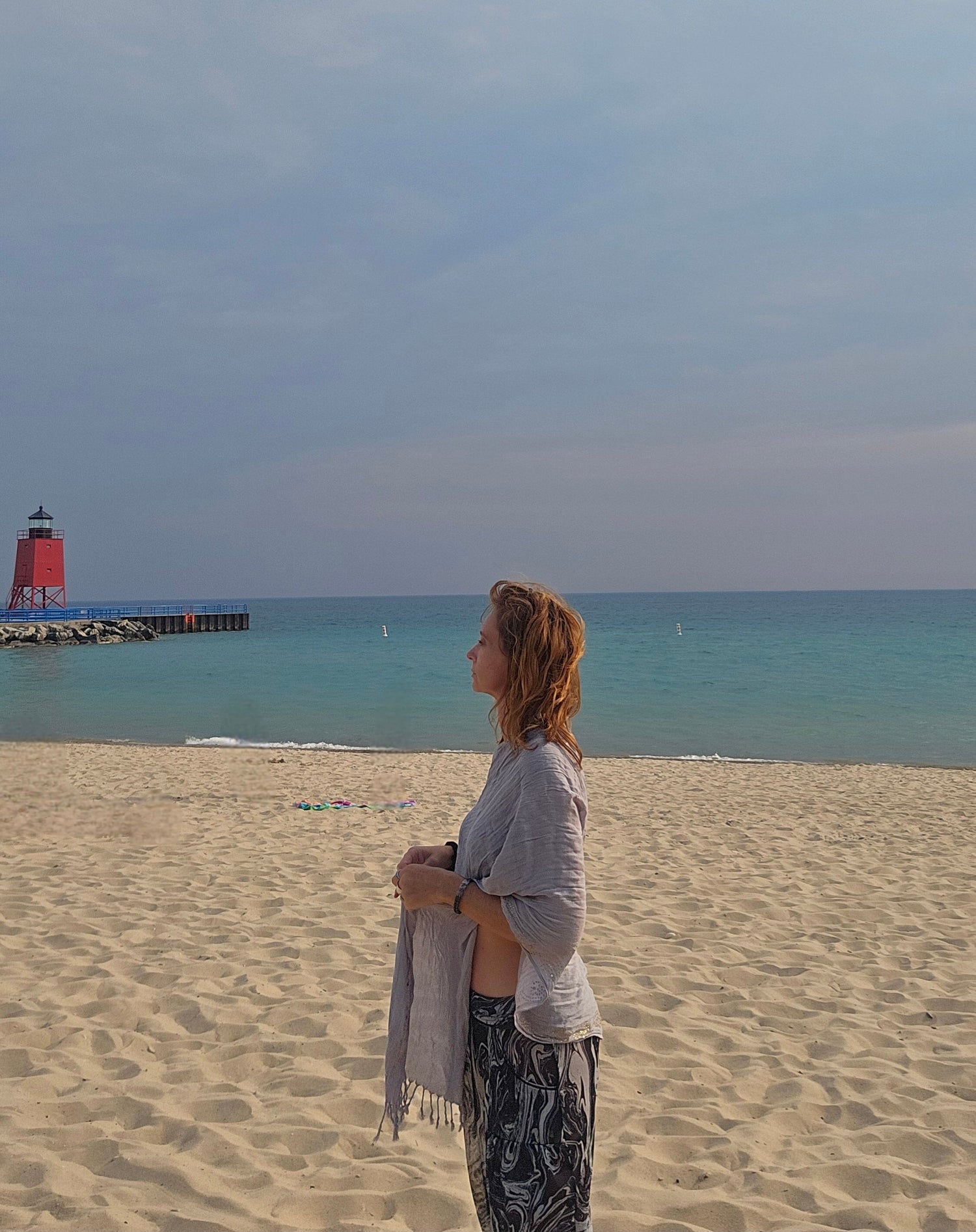 Lightweight poncho scarf worn as a beach cover up