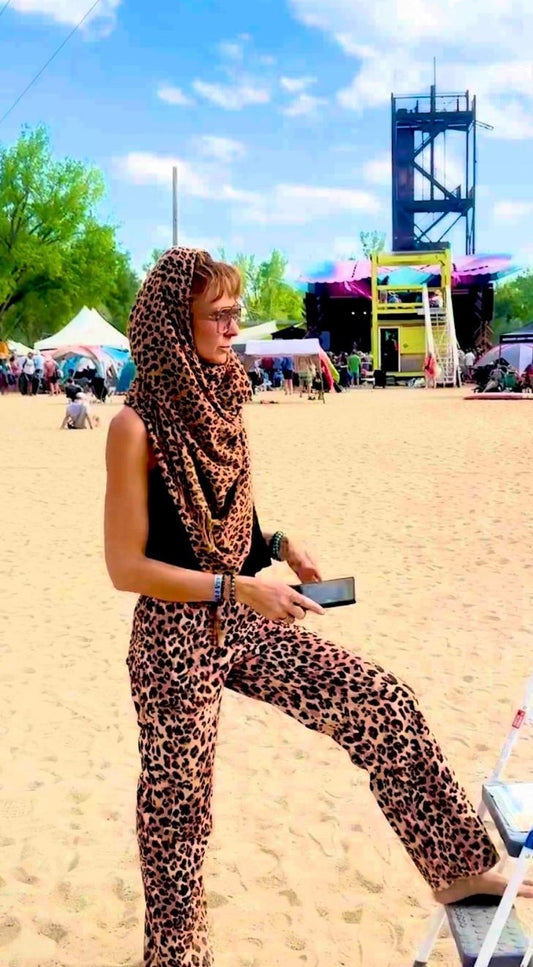 Harmonee wearing the cheetah print poncho scarf as a head wrap