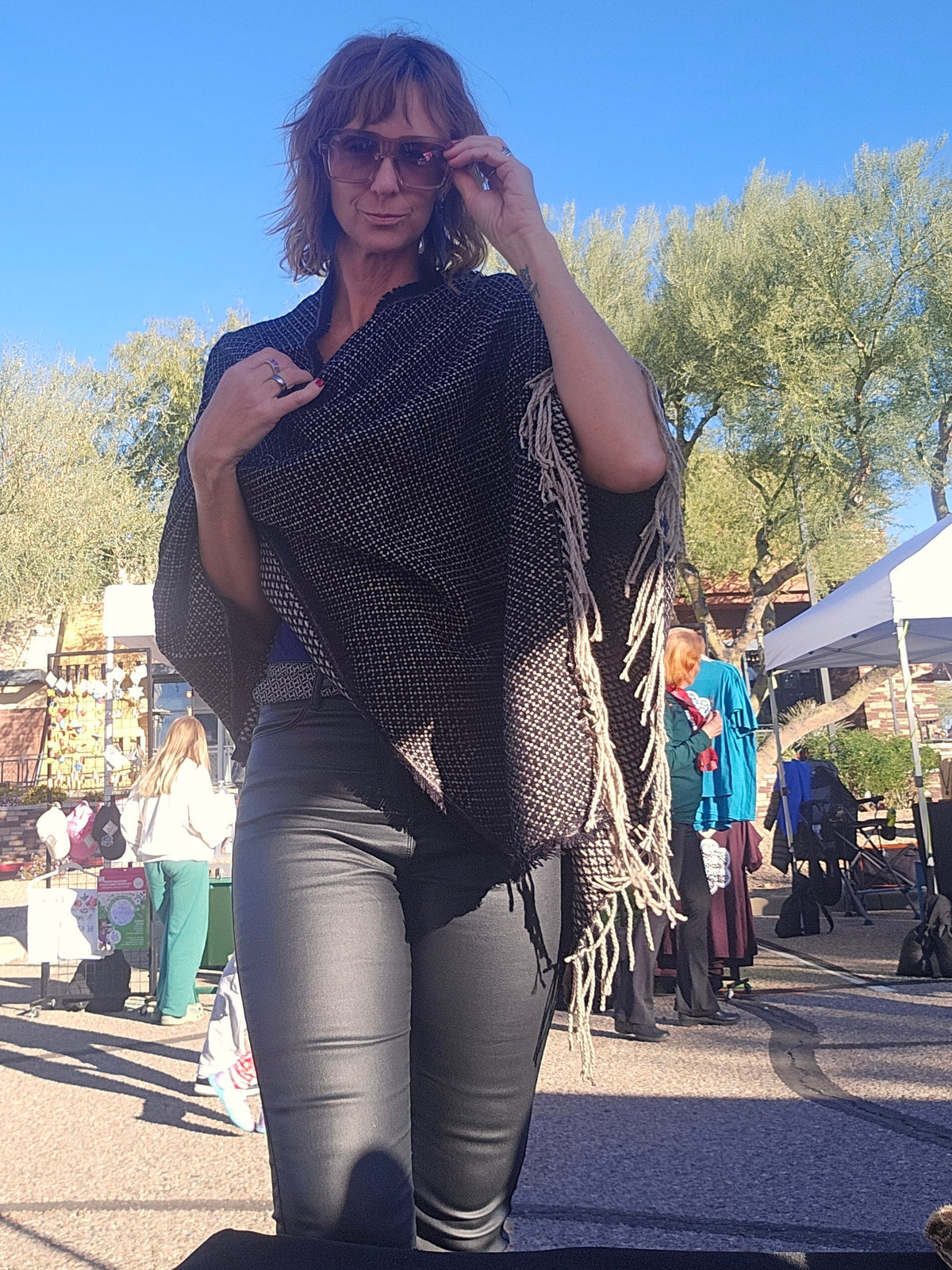 Cozy Fuzzy poncho scarf worn over a campfire evening outfit