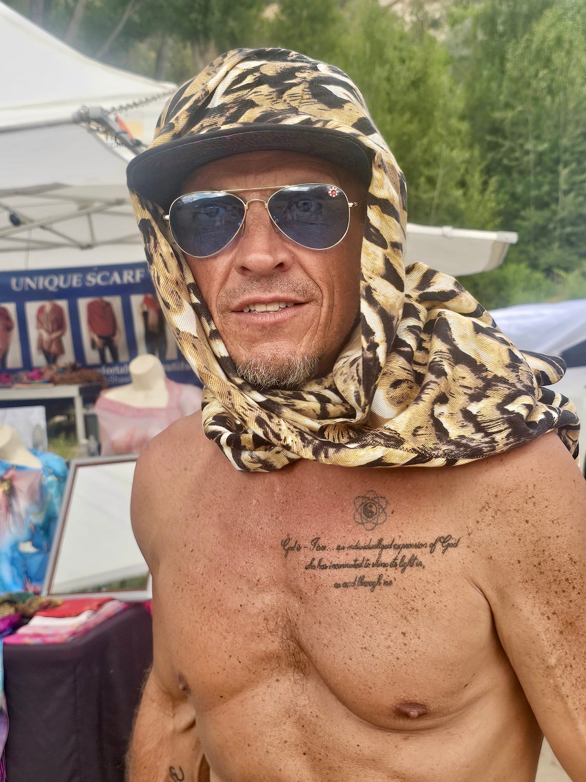 Owl Feather poncho scarf worn as a festival head wrap