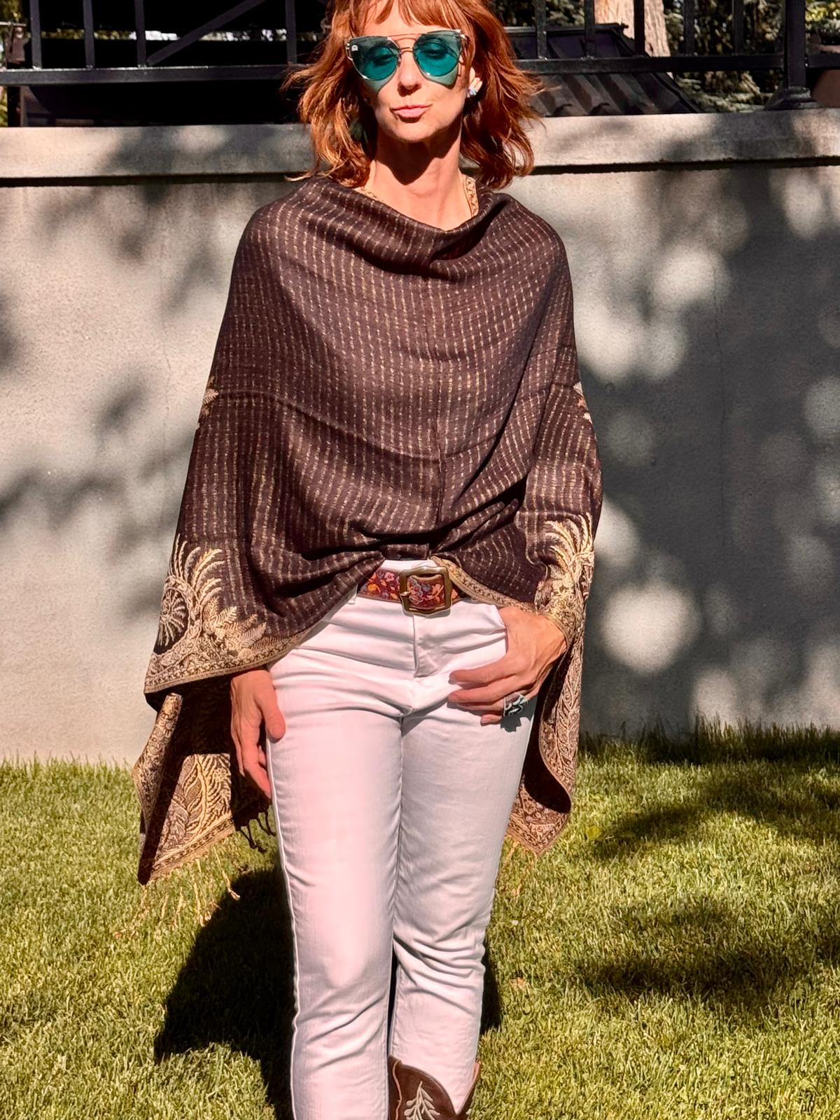 The seam worn at the back, shown on a black poncho scarf