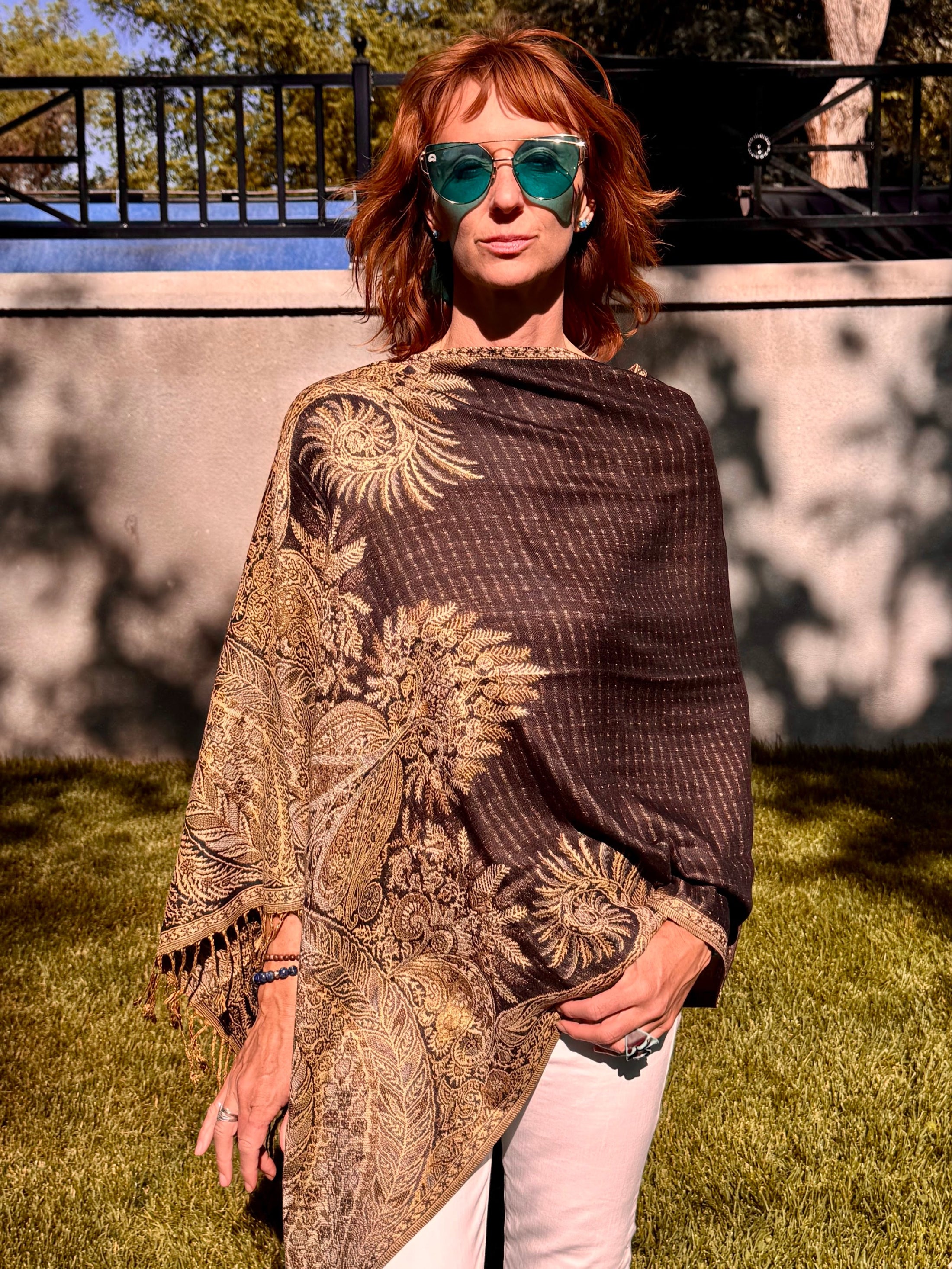 Black poncho scarf worn with the seam at the side