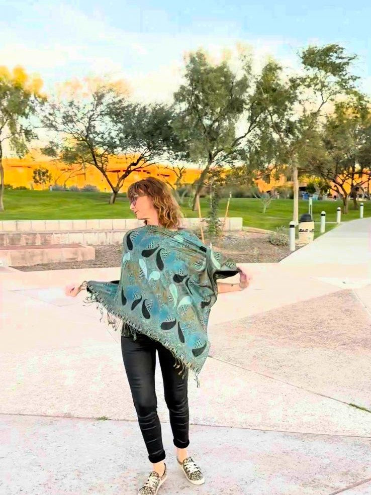 Harmonee moving in the turquoise Large Paisley poncho scarf
