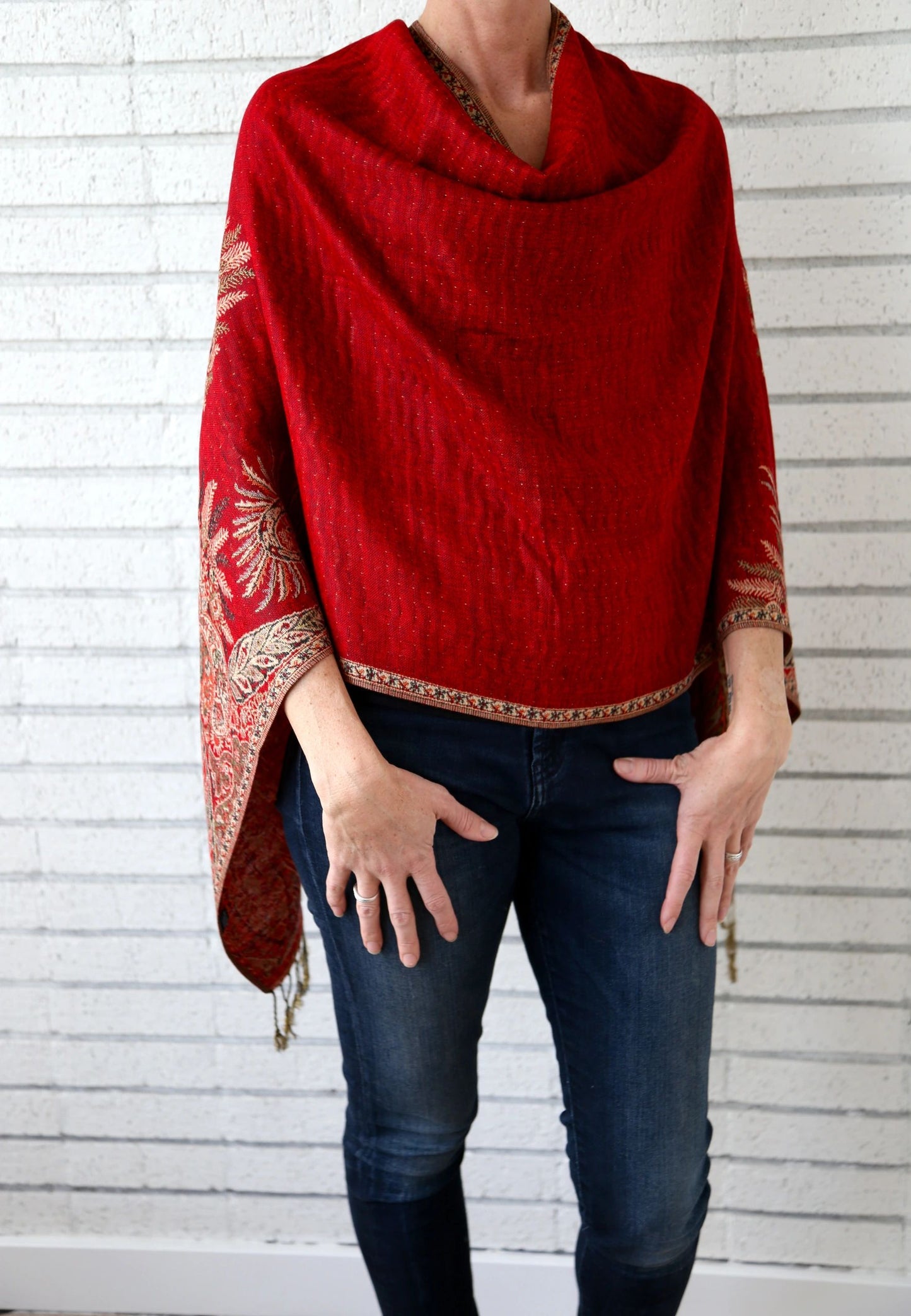 Red paisley poncho scarf worn with the seam at the back for a clean front line